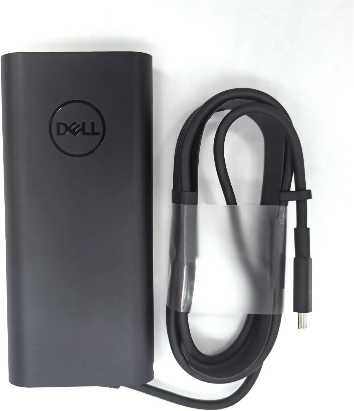 آداپتور دل 130 وات Type-C اورجینال در کنار لپ تاپ Dell XPS