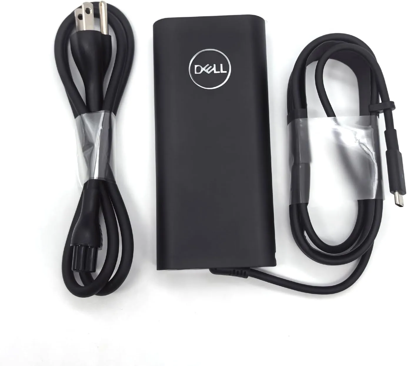 آداپتور دل 130 وات Type-C اورجینال در کنار لپ تاپ Dell XPS