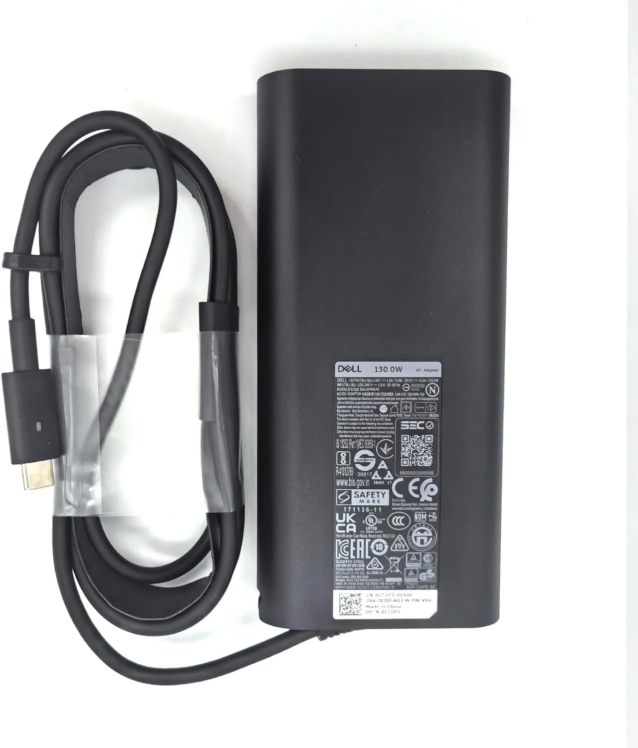آداپتور دل 130 وات Type-C اورجینال در کنار لپ تاپ Dell XPS